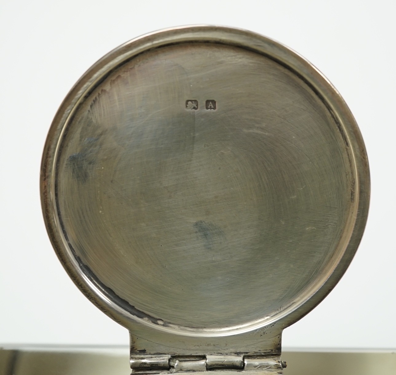A George V silver mounted glass square inkwell, John Grinsell & Sons, Birmingham, 1925, width 10.1cm.